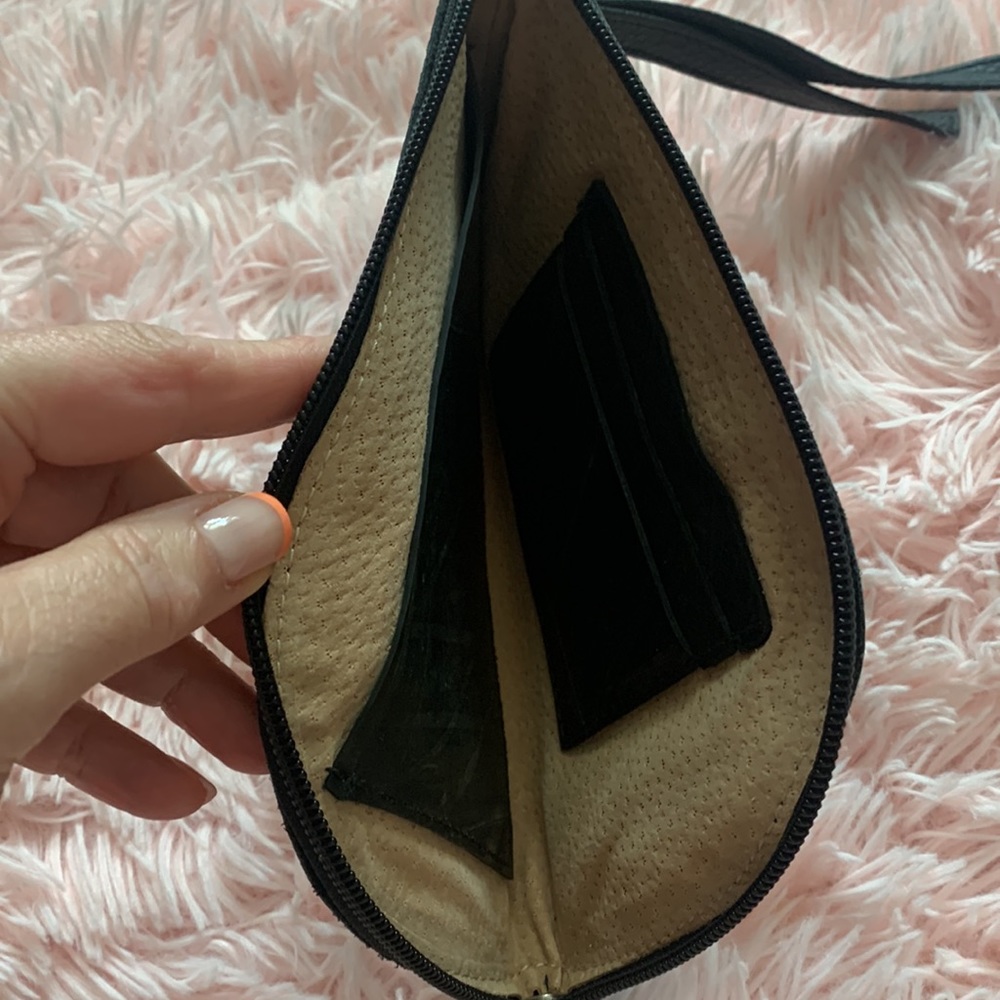 NWOT black leather wristlet holds phone lipstick and credit cards and a car key